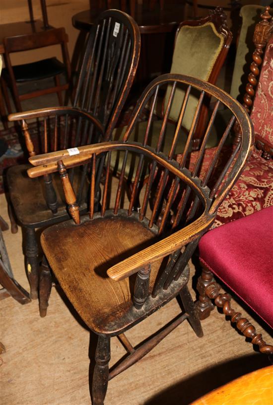 Two early 19th century elm and ash stick back elbow chairs